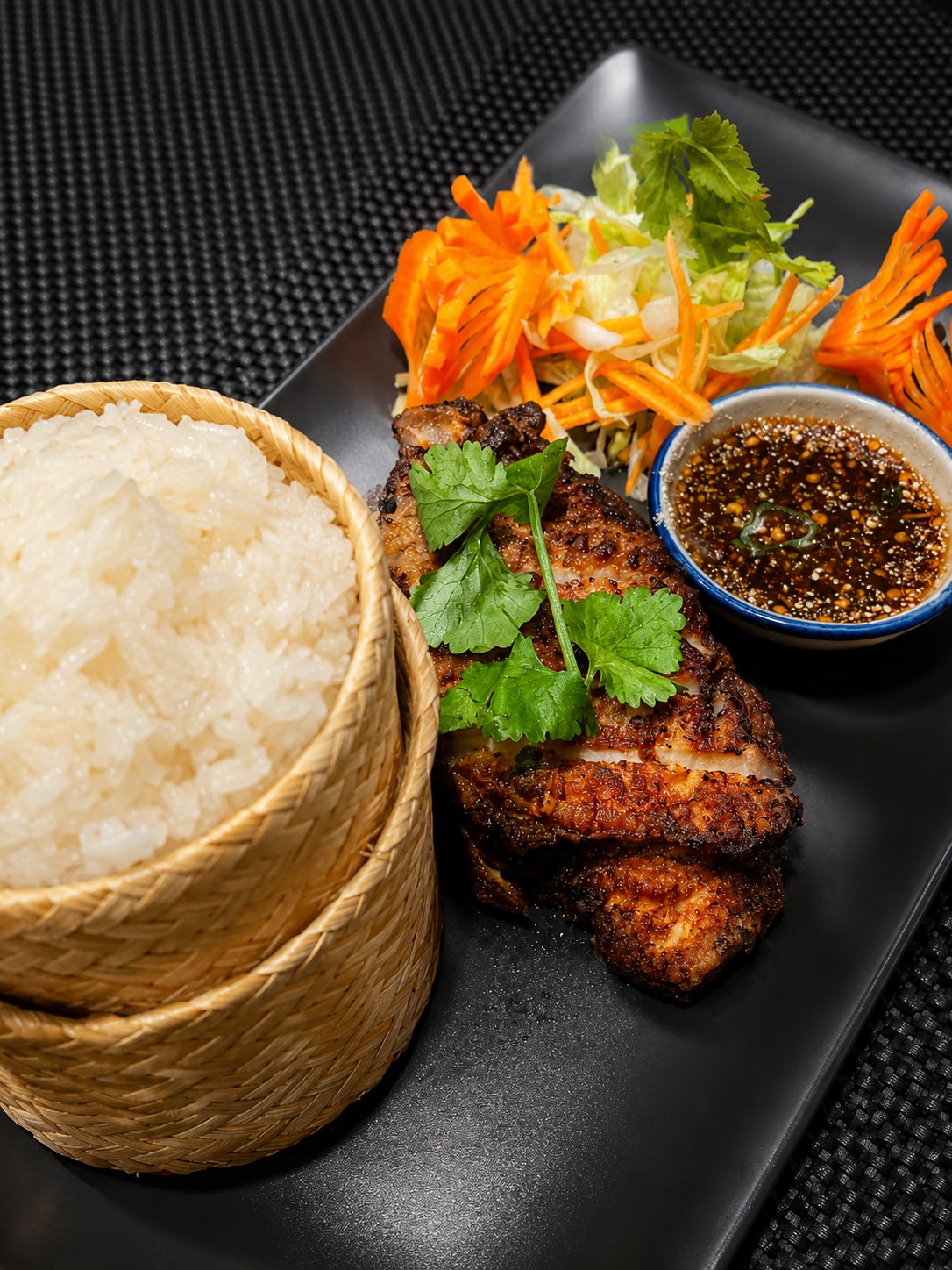 Grilled chicken with sticky rice, salad and dipping sauce