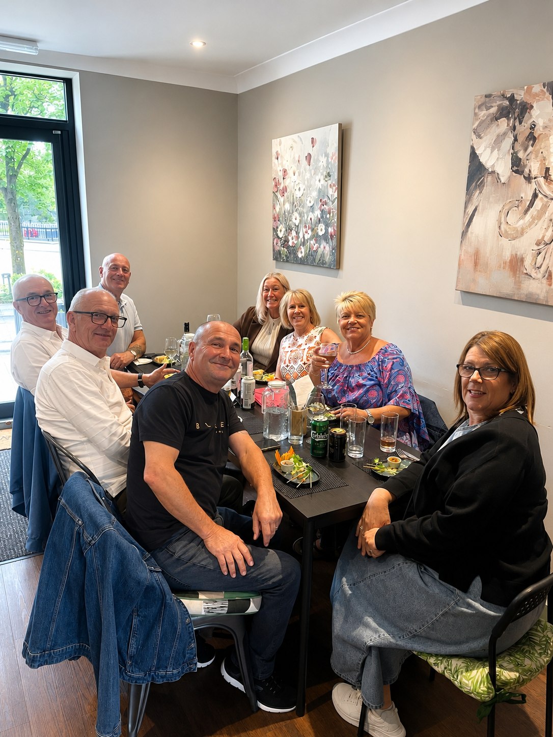 A group of diners enjoying a meal at Aroy Thai